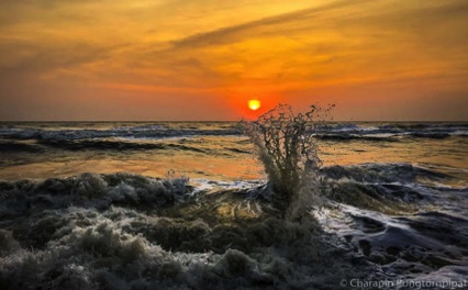 Sunset and sea splash